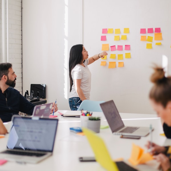 Colleagues talking through ideas in a meeting